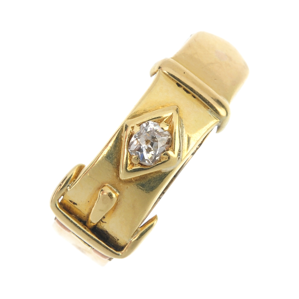 A late Victorian 18ct gold diamond buckle ring. Designed as a buckle, with old-cut diamond