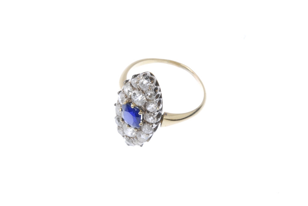 A sapphire and diamond cluster ring. The cushion-shape sapphire, within an old-cut diamond - Image 2 of 3