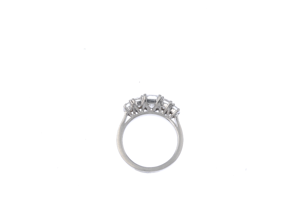 A platinum diamond five-stone ring. The rectangular brilliant-cut diamond, weighing 1.02cts, with - Image 3 of 8