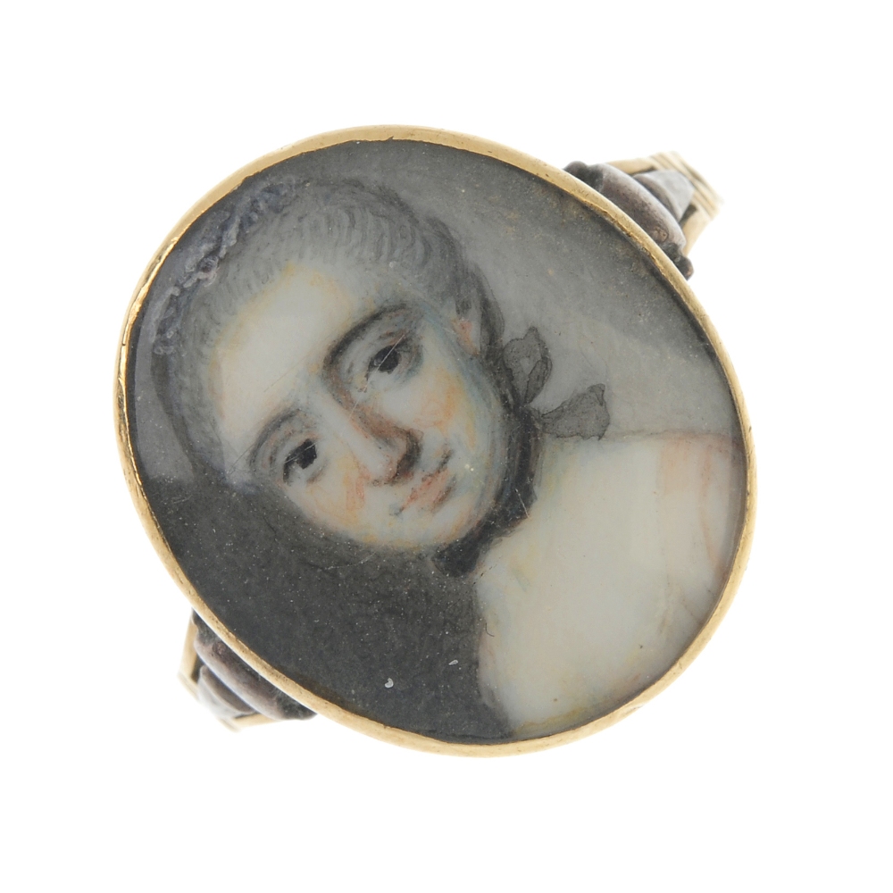 A late 18th century gold portrait miniature ring. The oval-shape panel painted to depict a woman