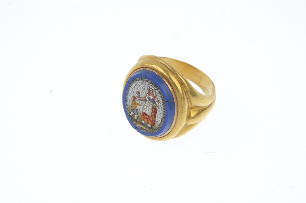 A late 19th century gold micro mosaic ring. Depicting a lady handing a red flower to a young boy, - Image 2 of 3