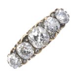 An early 20th century 18ct gold diamond five-stone ring. The old-cut diamond graduated line, with