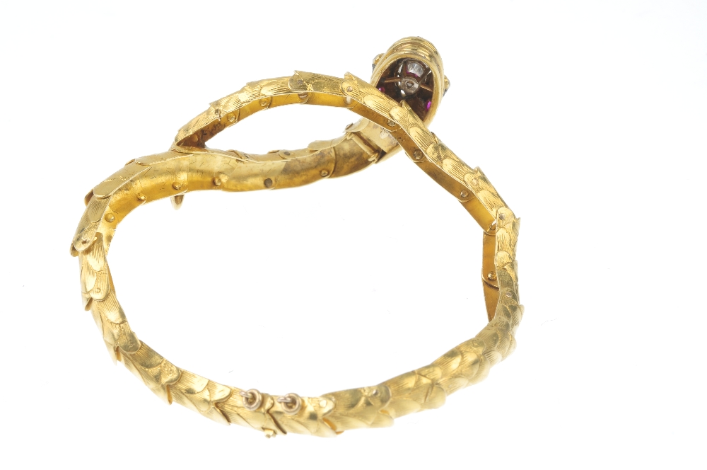 A diamond and ruby snake bracelet. The snake head set with a pear-shape diamond, with diamond - Image 2 of 3