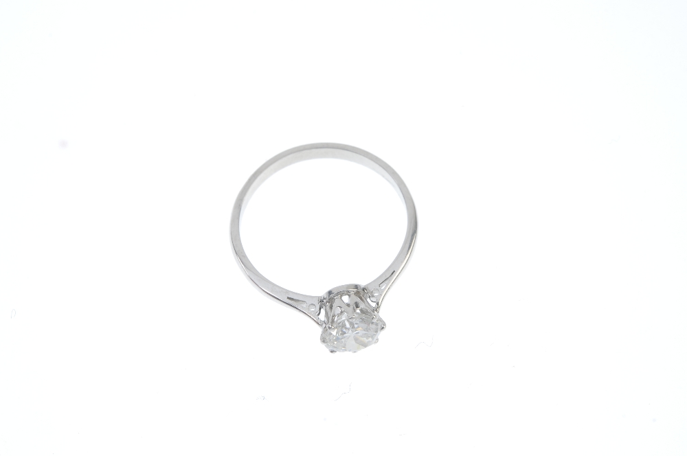 A diamond single-stone ring. The circular-cut diamond, to the tapered shoulders and plain band. - Image 2 of 3
