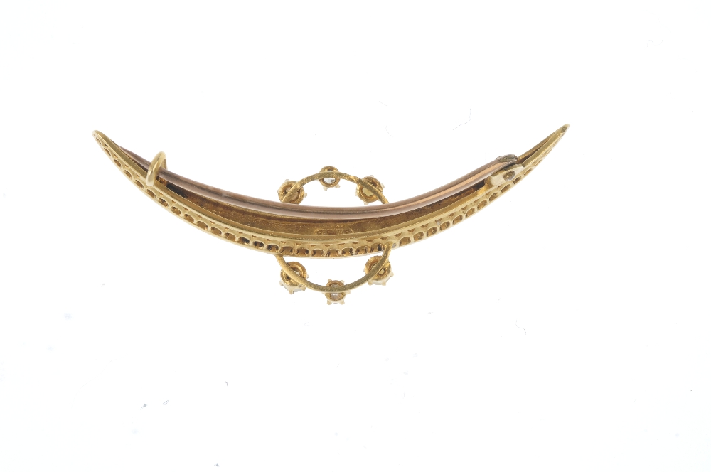 An early 20th century 18ct gold diamond and split pearl crescent brooch. Designed as a graduated - Image 2 of 2