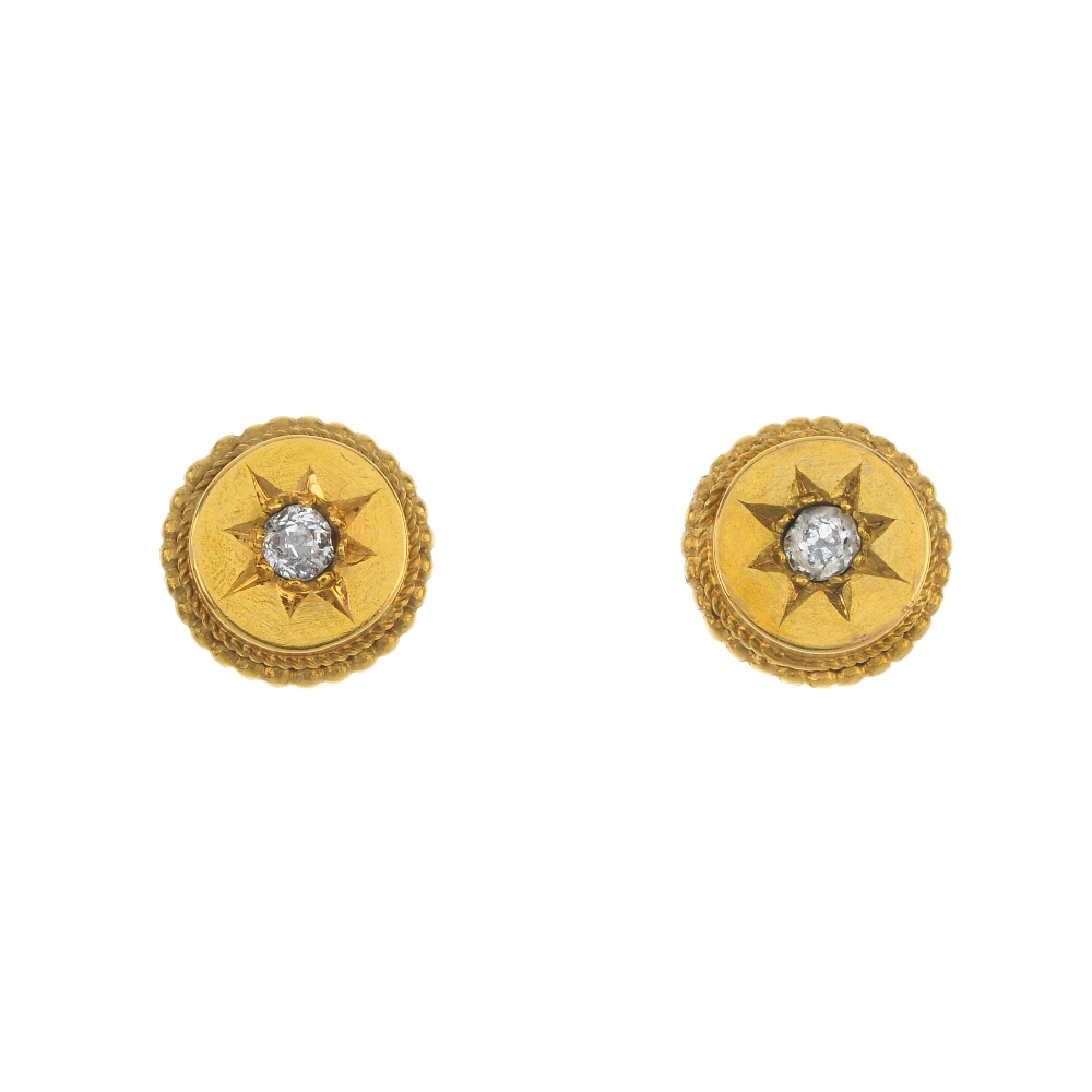 A pair of late 19th century diamond ear studs. Each designed as an old-cut diamond, within a star