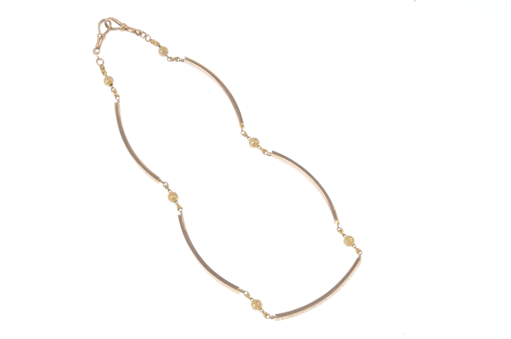 A late 19th century 9ct gold necklace. Designed as a series of curved bar links, with engraved - Image 2 of 2