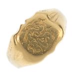 A late 19th century 18ct gold signet ring. The engraved initial monogram, to the tapered shoulders