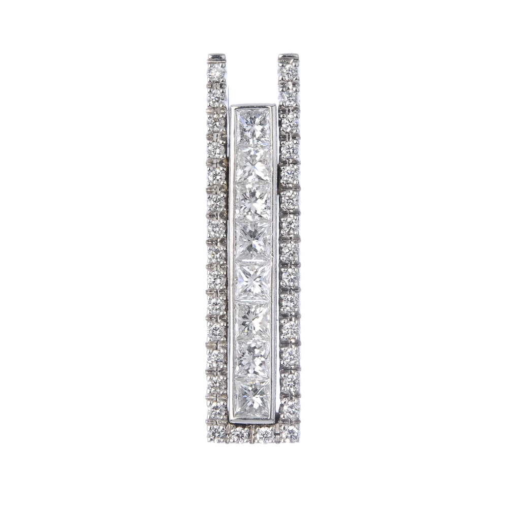 An 18ct gold diamond pendant. The square-shape diamond line, within a brilliant-cut diamond