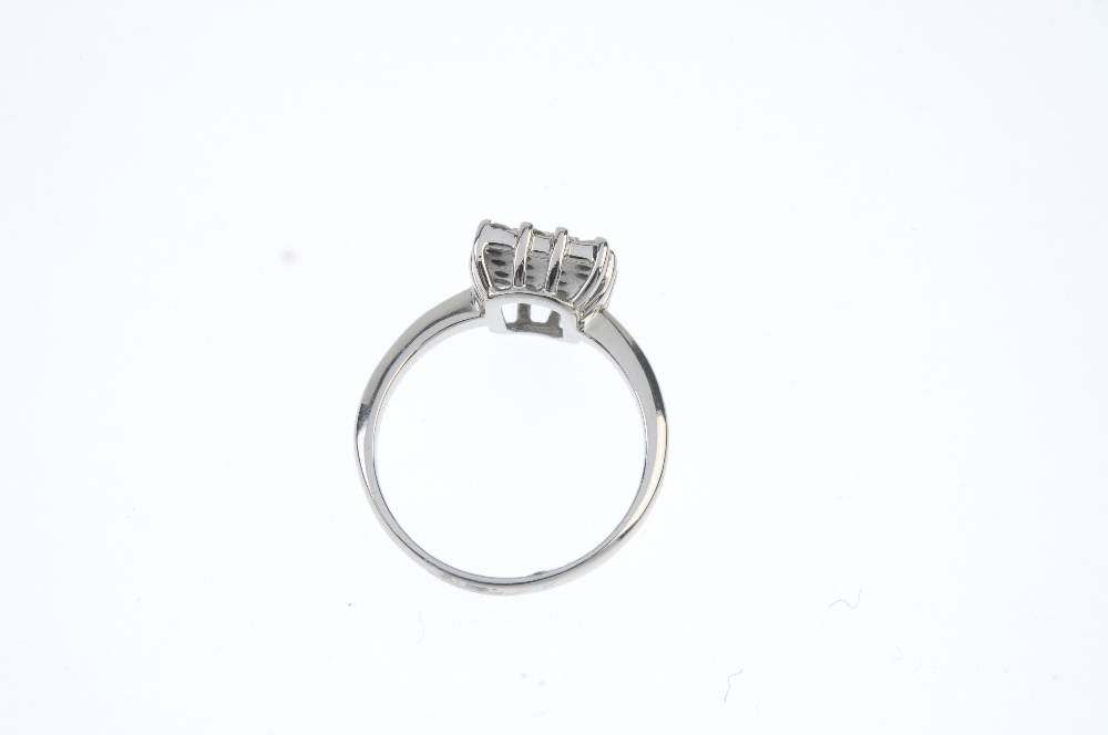 A diamond cluster ring. The brilliant-cut diamond square-shape panel, to the plain band. Estimated - Image 3 of 3