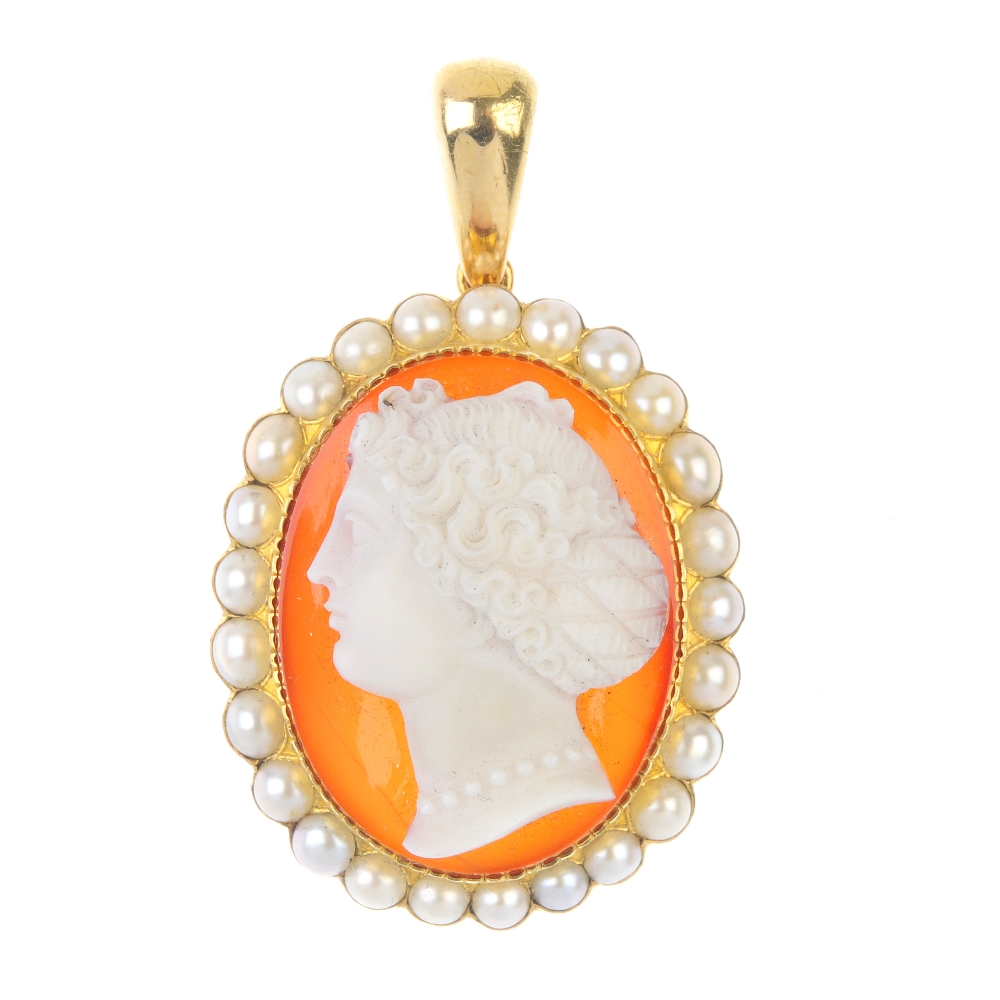 A late 19th century hardstone cameo and split pearl pendant. The oval cameo carved to depict a