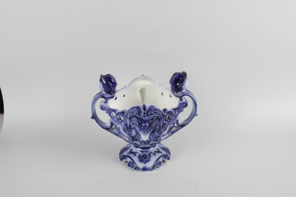 A German porcelain twin handled vase, modelled with twin ram head masks and stylized foliage upon - Image 3 of 3