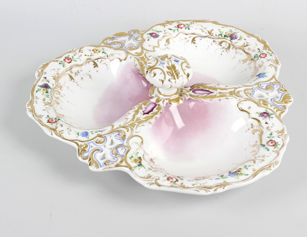 A porcelain hors d'oeuvres dish, formed as three shallow and lobed dishes having central knob