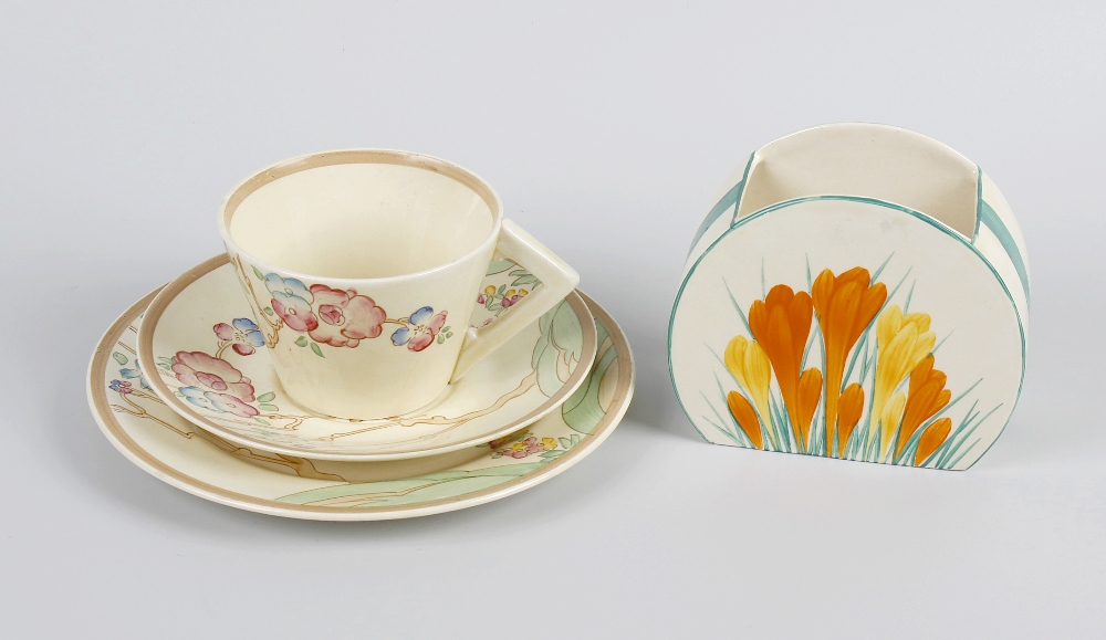 A Clarice Cliff crocus pattern bonjour shape vase, a Clarice Cliff Chippendale pattern tea cup,