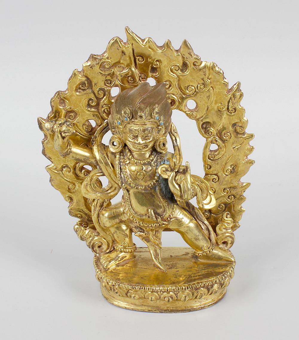 A good Sino Tibetan gilt bronze figure modeled as Buddhist deity. Probably Mahakala, 17th/18th