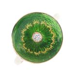 An Edwardian 18ct gold diamond and enamel ring. The green guilloche enamel disc, with central old-