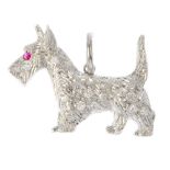 A diamond and ruby dog pendant. The single-cut diamond and textured Highland Terrier, with ruby eye.