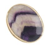 A 9ct gold blue john single-stone ring. The oval blue john cabochon, within a rope-twist surround.