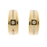 A pair of 18ct gold diamond earrings. Each of geometric design, the brilliant-cut diamond, with