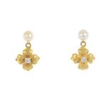 A pair of pearl and diamond earrings. Each designed as a pearl, suspending a brilliant-cut diamond