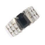(112531) A sapphire and diamond dress ring. The rectangular-shape sapphire, with brilliant-cut