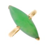 A mid 20th century gold jade single-stone ring. The marquise-shape jadeite cabochon, to the plain