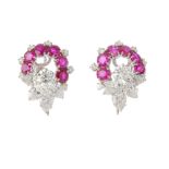 (201434) A pair of ruby and diamond earrings. Each designed as a brilliant-cut and pear-shape
