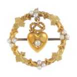 A late Victorian 15ct gold split and seed pearl lovers brooch. The split pearl star-set heart with