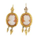 A pair of late 19th century gold, shell cameo earrings. Each designed as a graduated fringe,