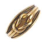 A late Victorian 18ct gold lover's knot ring. The lover's knot motif, with rope-twist and