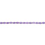 A 9ct gold amethyst and diamond bracelet. Designed as a series of oval-shape amethyst links, with