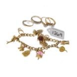 (PWN724) A selection of 9ct gold jewellery. To include a charm bracelet and four diamond rings.