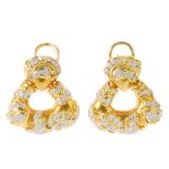 (117589) A pair of diamond earrings. Each designed as a a triangular-shape drop with brilliant-cut