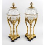 A pair of gilt metal and cut glass pedestal bowls, the circular and hobnail cut bowls having similar