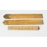 Three boxwood and brass mounted rulers, comprising Rabone, E. Preston & Sons, and H. Role