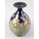 A Doulton Lambeth stoneware Art Nouveau vase, of pear form having a flared rim, decorated with