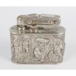 A Dutch silver mounted table lighter, of oblong form having embossed village and farming scene,
