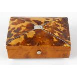 A Georgian tortoiseshell veneered miniature casket, the domed top with inset white metal panel