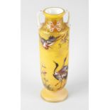 A late 19th century French yellow glass vase, of cylindrical form, with waisted twin handled neck