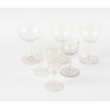 A large collection of mainly 19th century drinking glasses, each of clear glass, some having