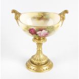 A Royal Worcester porcelain blush ivory pedestal dish, the oval dish painted with roses and signed