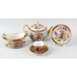 An early 19th century part tea set, of Imari style comprising a teapot, sugar bowl, various coffee
