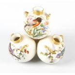 An unusual Royal Worcester porcelain stacking vase group, formed as four conjoined twin-handled