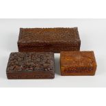 A large group of Eastern and other carved wooden boxes, plus various other examples with metal