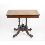 A Victorian inlaid walnut fold over card table, having banded and quartered inlay to the hinged