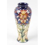 A modern Moorcroft pottery Lizard Orchid vase, by Philip Gibson, of slender baluster form with