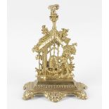 A Victorian brass pocket watch stand, modelled as two bears holding a honey pot beside sunflowers