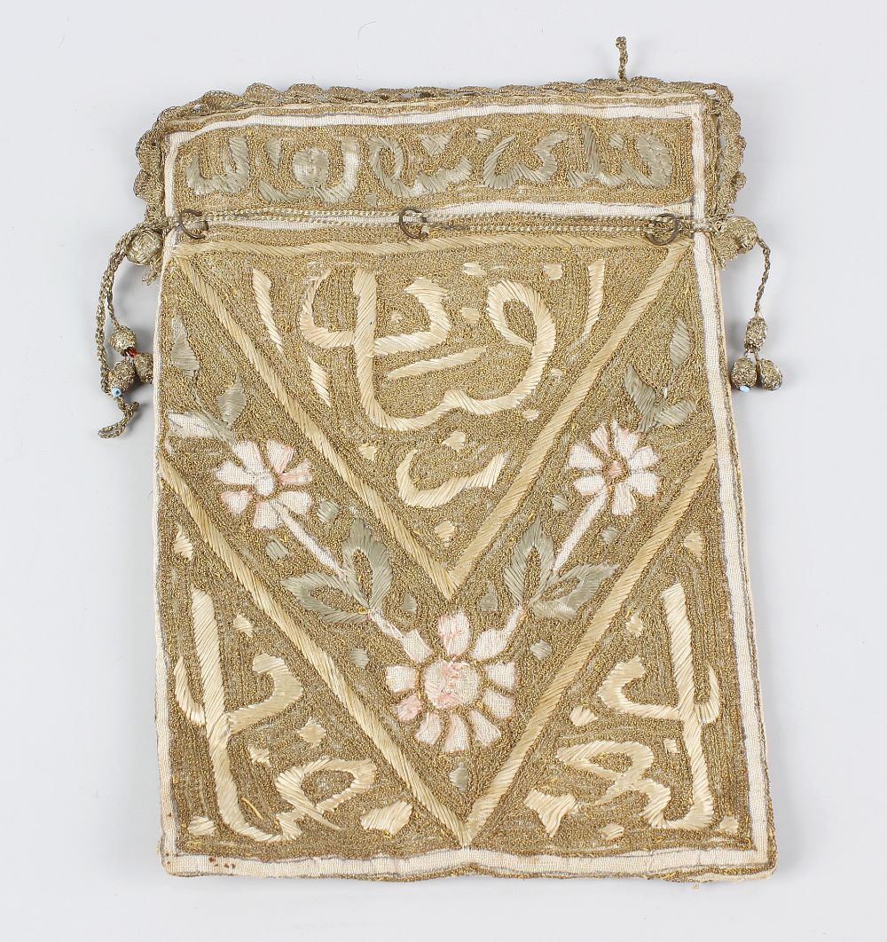 A late 19th century Islamic needlework Koran (Qur'an) cover, with stitched character and floral