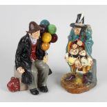 Two Royal Doulton figures, the first The Mask Seller HN2103, 9 (23cm) high, the second The Balloon