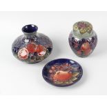 A group of three Moorcroft pottery Finches pattern items, comprising a ginger jar and cover, a small